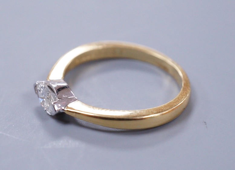 A modern 18ct gold and solitaire marquise cut diamond set ring, size L, gross weight 3 grams